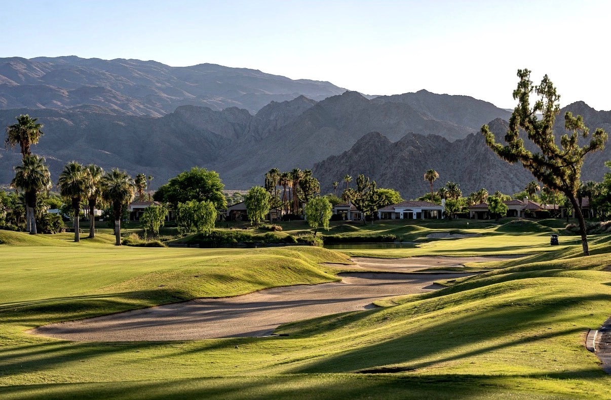 13th fairway at Jack Nicklaus Private Course, PGA West — bunkers, palms and Santa Rosa Mountains